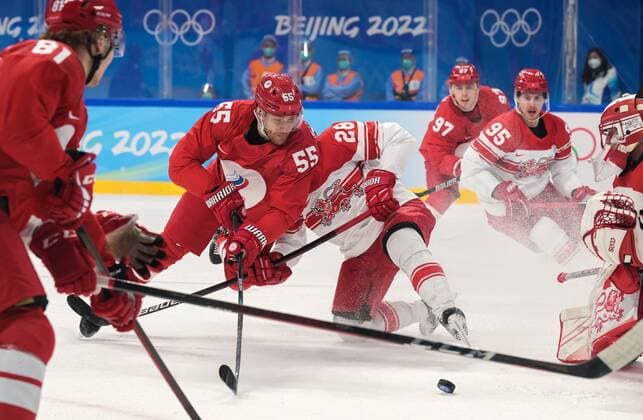 Sport Bilder des Tages China Olympics 2022 Ice hockey, Eishockey Men ROC - Denmark 8116425 16.02.2022 Russian Olympic Committee s Vladimir Tkachyov and Denmark s Emil Kristensen vie for the puck in the men s ice hockey qualification play-off match between the Russian Olympic Committee s team and Denmark during the Beijing 2022 Winter Olympic Games, Olympische Spiele, Olympia, OS at Wukesong Sports Centre in Beijing, China. Grigory Sysoev Sputnik Beijing China  Copyright: xGrigoryxSysoevx