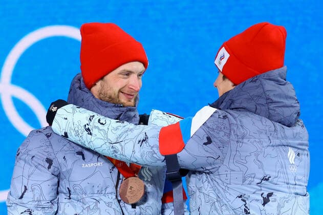 BEIJING 2022, Biathlon, 4x7,5km Staffel MÃ¤nner, Siegerehrung ZHANGJIAKOU, CHINA - FEBRUARY 16, 2022: ROC athletes Maxim Tsvetkov (L) and Eduard Latypov celebrate their bronze medals during the men s biathlon relay victory ceremony at the Medal Plaza as part of the 2022 Winter Olympic Games, Olympische Spiele, Olympia, OS Stanislav Krasilnikov TASS  TS123950
