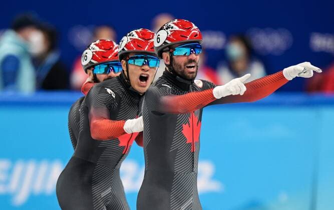 China Olympics 2022 Short Track Speed skating, Eisschnelllauf 8117090 16.02.2022 Canada s Charles Hamelin, Jordan Pierre-Gilles and Steven Dubois celebrate winning the short track speed skating men s 5000m relay final A during the Beijing 2022 Winter Olympic Games, Olympische Spiele, Olympia, OS at Capital Indoor Stadium in Beijing, China. Grigory Sysoev Sputnik Beijing China  Copyright: xGrigoryxSysoevx