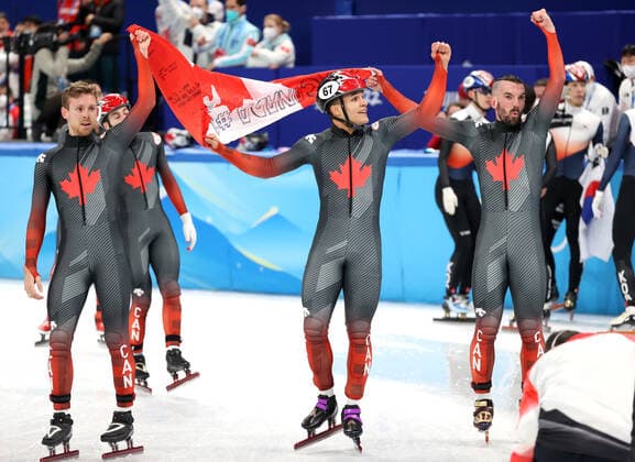 BEIJING, CHINA - FEBRUARY 16, 2022: Team Canada celebrate winning gold medals in the men s 5000m short track Speed skating, Eisschnelllauf relay at the 2022 Winter Olympic Games, Olympische Spiele, Olympia, OS at the Capital Indoor Stadium. Anton Novoderezhkin TASS  TS1239C2