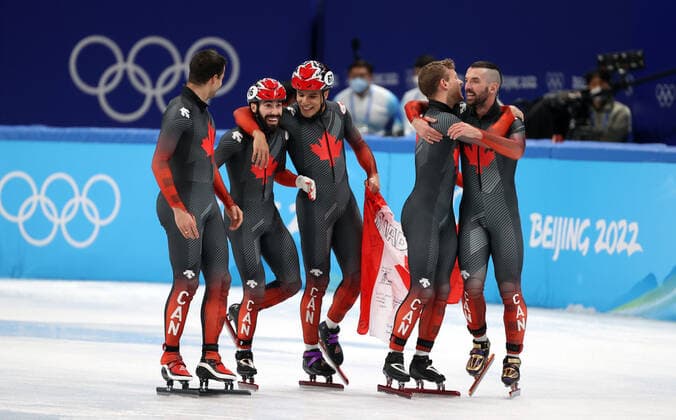 BEIJING, CHINA - FEBRUARY 16, 2022: Team Canada celebrate winning gold medals in the men s 5000m short track Speed skating, Eisschnelllauf relay at the 2022 Winter Olympic Games, Olympische Spiele, Olympia, OS at the Capital Indoor Stadium. Anton Novoderezhkin TASS  TS1239C3