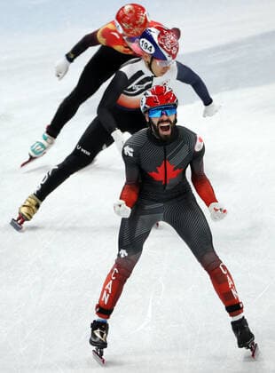 BEIJING, CHINA - FEBRUARY 16, 2022: Steven Dubois of Canada, Kwak Yoon-gy of South Korea and Li Wenlong (R-L) of China compete in a men s 5000m short track Speed skating, Eisschnelllauf relay final at the 2022 Winter Olympic Games, Olympische Spiele, Olympia, OS at the Capital Indoor Stadium. Valery Sharifulin TASS  TS1239F8