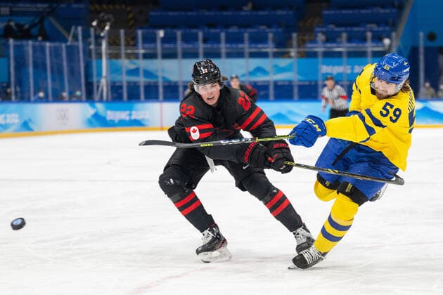 220216 Owen Power of Canada and Linus Johansson of Sweden in the mens ice hockey quarterfinal between Sweden and Canada during day 12 of the 2022 Winter Olympics on February 16, 2022 in Beijing Photo Maxim Thore BILDBYRAN kod MT MT0326 ice hockey ice hockey olympic games olympics winter olympics os ol olympic games winter os olympic games beijing peking 2022 beijing 2022 beijing 2022 olympic games beijing 2022 winter olympic games beijing os beijing ol winter ol 12 bbeng quarter final sweden canada,  Copyright: MAXIMxTHORE BB220216MT157