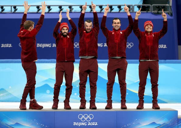 BEIJING, CHINA - FEBRUARY 16, 2022: Gold medalists, Team Canada attend a flower ceremony for the men s 5000m short track Speed skating, Eisschnelllauf relay at the 2022 Winter Olympic Games, Olympische Spiele, Olympia, OS at the Capital Indoor Stadium. Anton Novoderezhkin TASS  TS123A3A