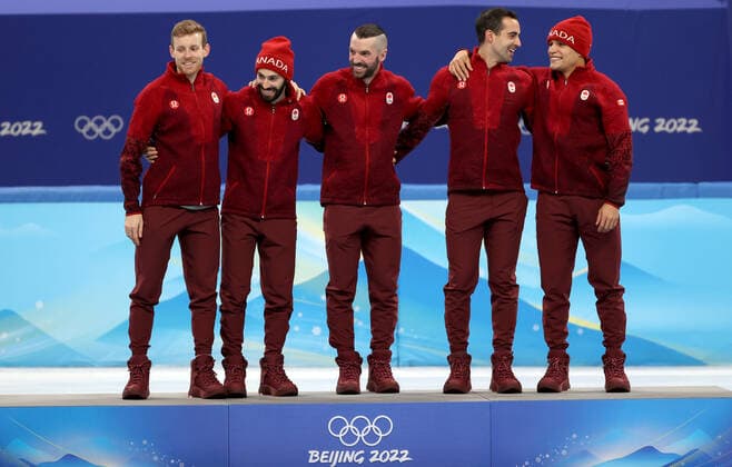 BEIJING, CHINA - FEBRUARY 16, 2022: Gold medalists, Team Canada attend a flower ceremony for the men s 5000m short track Speed skating, Eisschnelllauf relay at the 2022 Winter Olympic Games, Olympische Spiele, Olympia, OS at the Capital Indoor Stadium. Anton Novoderezhkin TASS  TS123A3B