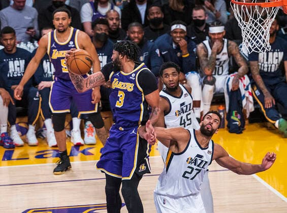 February 16, 2022, Los Angeles, California, USA: Anthony Davis 3 of the Los Angeles Lakers wins an offensive round from Rudy Gobert 27 of the Utah Jazz during their NBA, Basketball Herren, USA home game on Wednesday February 16, 2022 at Crypto.com Arena in Los Angeles, California. Davis injures his ankle as he comes down with the ball. PI Los Angeles USA - ZUMAp124 20220216_zaa_p124_021 Copyright: xJAVIERxROJASx