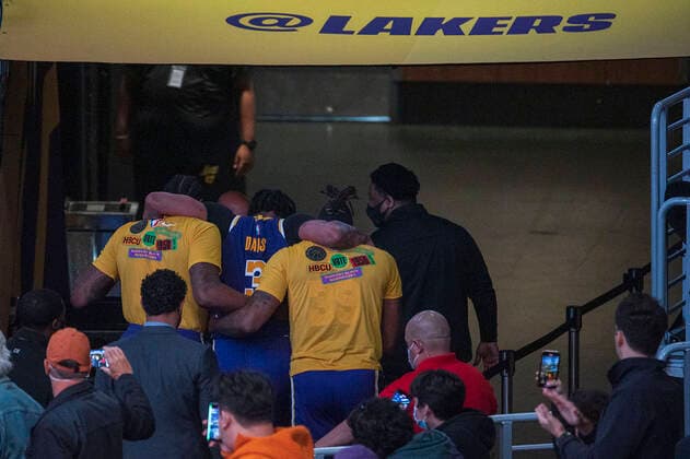 February 16, 2022, Los Angeles, California, USA: Anthony Davis 3 of the Los Angeles Lakers is carried off the court after an ankle injury in the second quarter of their NBA, Basketball Herren, USA home game against the Utah Jazz on Wednesday February 16, 2022 at Crypto.com Arena in Los Angeles, California. PI Los Angeles USA - ZUMAp124 20220216_zaa_p124_026 Copyright: xJAVIERxROJASx