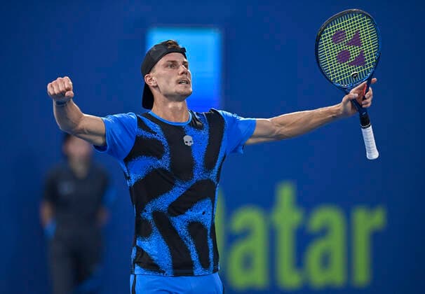 (220217) -- DOHA, Feb. 17, 2022 -- Marton Fucsovics of Hungary celebrates after winning the second round of ATP, Tennis Herren Qatar Open Tennis match against Kwon Soonwoo of South Korea at the Khalifa International Tennis Complex in Doha, capital of Qatar, Feb. 16, 2022. (Photo by Xinhua) (SP)QATAR-DOHA Table tennis, Tischtennis ATP QATAR OPEN-SECOND ROUND Nikku 