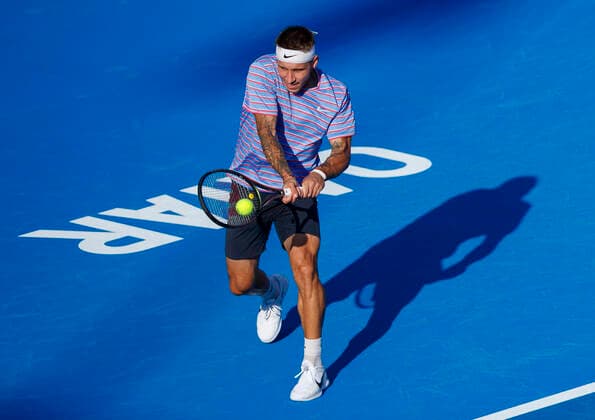 (220217) -- DOHA, Feb. 17, 2022 -- Alex Molcan of Slovakia returns the ball during the second round of ATP, Tennis Herren Qatar Open Tennis match against Denis Shapovalov of Canada at the Khalifa International Tennis Complex in Doha, capital of Qatar, Feb. 16, 2022. (Photo by Xinhua) (SP)QATAR-DOHA Table tennis, Tischtennis ATP QATAR OPEN-SECOND ROUND Nikku 