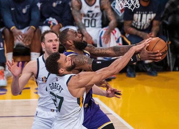 February 16, 2022, Los Angeles, California, USA: LeBron James 6 of the Los Angeles Lakers is blocked by Rudy Gobert 27 of the Utah Jazz as he goes for a layup during their NBA, Basketball Herren, USA game on Wednesday February 16, 2022 at Crypto.com Arena in Los Angeles, California. Lakers defeat Jazz, 106-101. PI Los Angeles USA - ZUMAp124 20220216_zaa_p124_034 Copyright: xJAVIERxROJASx