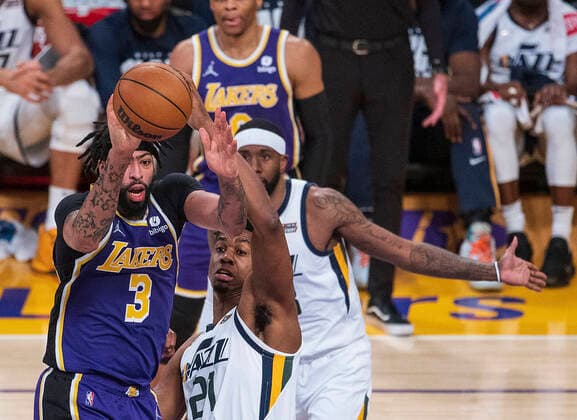 February 16, 2022, Los Angeles, California, USA: Anthony Davis 3 of the Los Angeles Lakers passes away from Hassan Whiteside 21 of the Utah Jazz during their NBA, Basketball Herren, USA game on Wednesday February 16, 2022 at Crypto.com Arena in Los Angeles, California. Lakers defeat Jazz, 106-101. PI Los Angeles USA - ZUMAp124 20220216_zaa_p124_033 Copyright: xJAVIERxROJASx