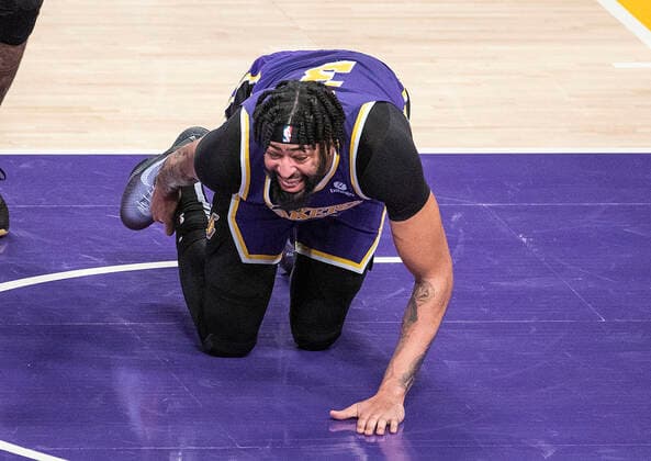 February 16, 2022, Los Angeles, California, USA: Anthony Davis 3 of the Los Angeles Lakers goes down in pain after injuring his ankle on an offensive rebound in the second quarter of their NBA, Basketball Herren, USA home game against the Utah Jazz on Wednesday February 16, 2022 at Crypto.com Arena in Los Angeles, California. PI Los Angeles USA - ZUMAp124 20220216_zaa_p124_045 Copyright: xJAVIERxROJASx