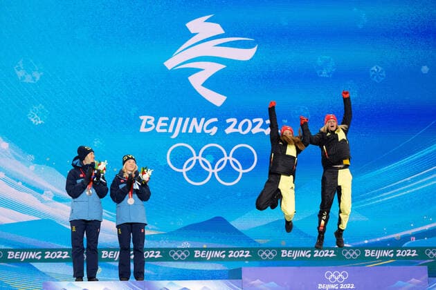 220217 Maja Dahlqvist and Jonna Sundling of Sweden look at Katharina Hennig and Victoria Carl of Germany as the jump ont the podium at the medal ceremony for women s cross country skiing team sprint during day 13 of the 2022 Winter Olympics on February 17, 2022 in Zhangjiakou Photo Vegard Grott PICTURE AGENCY code VG JM0291 bbeng olympic games olympics winter olympics os ol olympic games winter os olympics leek peking peking 2022 beijing 2022 beijing 2022 olympic games beijing 2022 winter olympic games peking os beijing ol winter ol medal ceremony medal ceremony germany sprint team sprint team sprint,  Copyright: VEGARDxGRoTT BB220217VG001