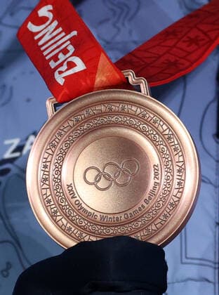ZHANGJIAKOU, CHINA - FEBRUARY 17, 2022: Alexander Bolshunov of Team ROC holds his bronze medal during the victory ceremony for the men s cross-country skiing team sprint classic, at the Medal Plaza, at the 2022 Winter Olympic Games, Olympische Spiele, Olympia, OS Stanislav Krasilnikov TASS  TS123CFB