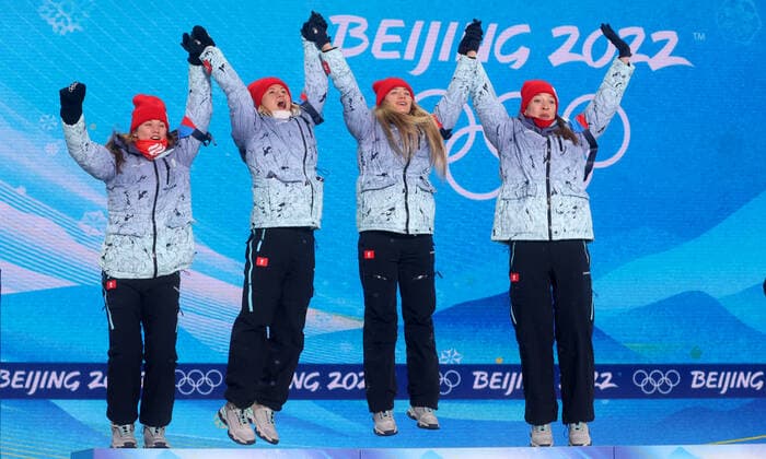 ZHANGJIAKOU, CHINA - FEBRUARY 17, 2022: Silver medallists Irina Kazakevich, Kristina Reztsova, Svetlana Mironova and Ulyana Nigmatullina of Team ROC (L-R) celebrate during the victory ceremony for the women s biathlon 4x7.5km relay, at the Medal Plaza, at the 2022 Winter Olympic Games, Olympische Spiele, Olympia, OS Stanislav Krasilnikov TASS  TS123D15