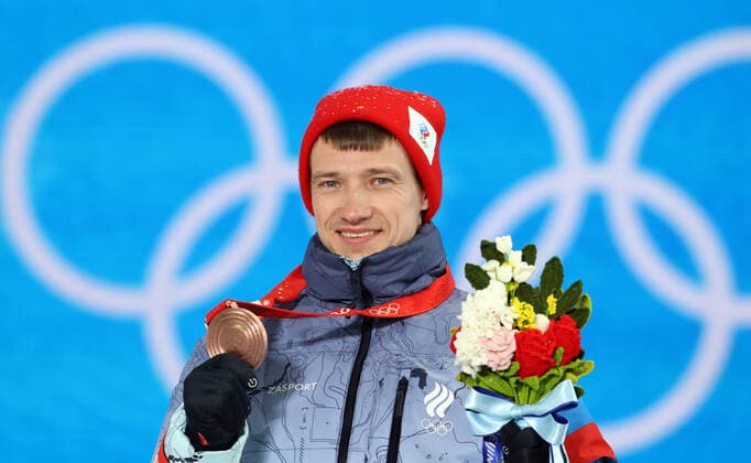 ZHANGJIAKOU, CHINA - FEBRUARY 17, 2022: Bronze medallist Ilya Burov of Team ROC is seen during the victory ceremony for the men s freestyle skiing aerials, at the Medal Plaza, at the 2022 Winter Olympic Games, Olympische Spiele, Olympia, OS Stanislav Krasilnikov TASS  TS123D36