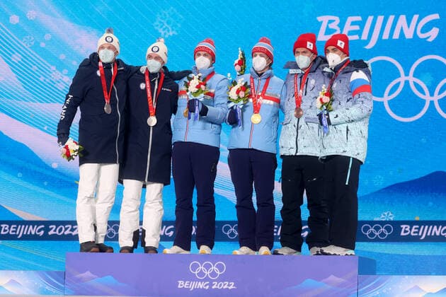 ZHANGJIAKOU, CHINA - FEBRUARY 17, 2022: Silver medallists Iivo Niskanen and Joni Maki of Finland, gold medal winners Erik Valnes and Johannes Hoesflot Klaebo of Norway and bronze medallists Alexander Bolshunov and Alexander Terentyev of Team ROC (L-R) celebrate during the victory ceremony for the men s cross-country skiing team sprint classic, at the Medal Plaza, at the 2022 Winter Olympic Games, Olympische Spiele, Olympia, OS Stanislav Krasilnikov TASS  TS123D58