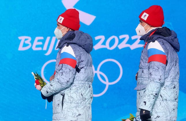 ZHANGJIAKOU, CHINA - FEBRUARY 17, 2022: Bronze medallists Alexander Bolshunov (L) and Alexander Terentyev of Team ROC are seen during the victory ceremony for the men s cross-country skiing team sprint classic, at the Medal Plaza, at the 2022 Winter Olympic Games, Olympische Spiele, Olympia, OS Stanislav Krasilnikov TASS  TS123D59