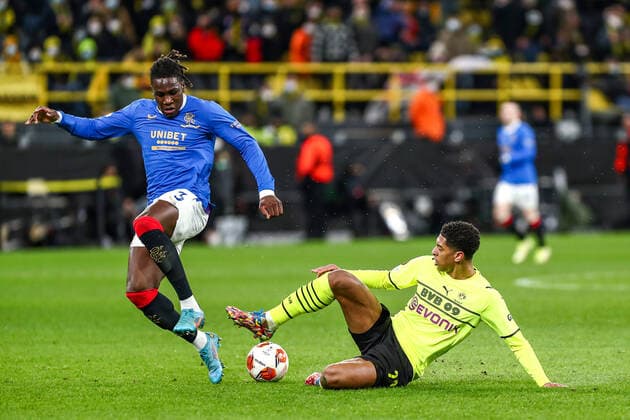 Jude Bellingham Borussia Dortmund BVB, 22 in duel against Calvin Bassey Glasgow Rangers FC, 03 , GER, Borussia Dortmund BVB vs Glasgow Rangers FC, K o Runden Play off, Europa League, Spielzeit 2021 2022, 17 02 2022, DFB DFL regulations prohibit any use of photographs as image sequences and or quasi video , GER, Borussia Dortmund BVB vs Glasgow Rangers FC, K o Runden Play off, Europa League, Spielzeit 2021 2022, 17 02 2022 Dortmund Copyright: xEibner-Pressefoto GabrielxBoiax EP_EEP
