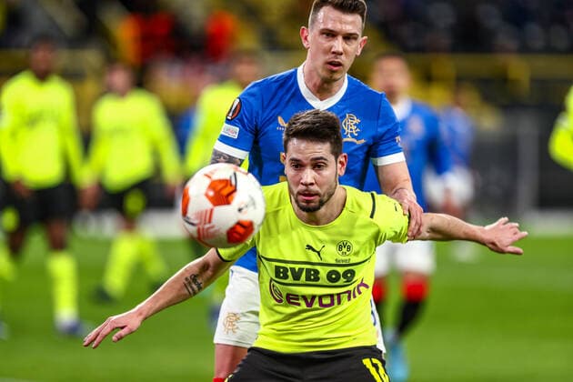 Raphael Guerreiro Borussia Dortmund BVB, 13 in duel against Borna Barisic Glasgow Rangers FC, 31 , GER, Borussia Dortmund BVB vs Glasgow Rangers FC, K o rounds play off, Europa League, season 2021 2022, 17 02 2022, DFB DFL regulations prohibit any use of photographs as image sequences and or quasi video , GER, Borussia Dortmund BVB vs Glasgow Rangers FC, K o rounds play off, Europa League, season 2021 2022, 17 02 2022 Dortmund Copyright: xEibner-Pressefoto GabrielxBoiax EP_EEP