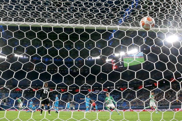ST PETERSBURG, RUSSIA - FEBRUARY 17, 2022: Zenit s goalkeeper Mikhail Kerzhakov (L) concedes a goal in the 1st leg of the 2021 22 UEFA Europa League play-offs between Zenit St Petersburg and Real Betis Seville at Gazprom Arena. Alexander Demianchuk TASS  TS123F12