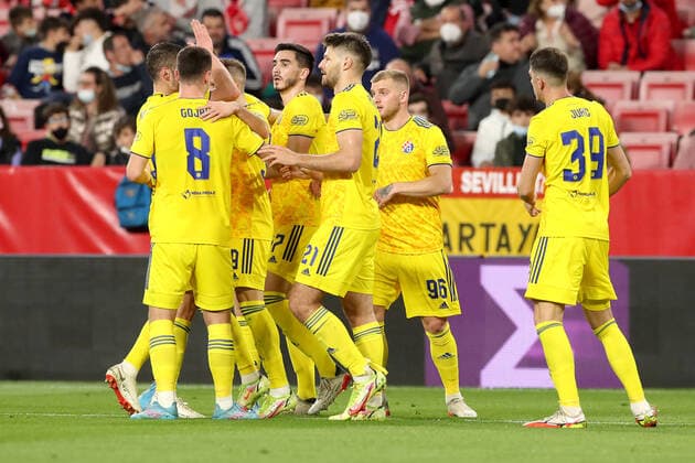 Sevilla FC v Dinamo Zagreb: Knockout Round Play-Offs Leg One - UEFA Europa League Mislav Orsic of Dinamo Zagreb celebrate with his teammates after scoring during the UEFA Europa League Knockout Round Play-Offs Leg One match between Sevilla FC and Dinamo Zagreb at Estadio Ramon Sanchez Pizjuan on February 17, 2022 in Seville, Spain. GoranxStanzl PIXSELL