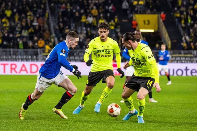Mandatory Credit: Photo by Kirk O Rourke Rangers FC Shutterstock (12811477kh) Ryan Kent of Rangers attacks Nico Schulz of Borussia Dortmund during the Europa League match at the Signal Iduna Park, Dortmund. Borussia Dortmund v Rangers, UEFA Europa League, Round of 32, Westfalenstadion, Dortmund, Germany - 17 Feb 2022 Borussia Dortmund v Rangers, UEFA Europa League, Round of 32, Westfalenstadion, Dortmund, Germany - 17 Feb 2022 Copyright: xKirkxO Rourke RangersxFC Shutterstockx 12811477kh
