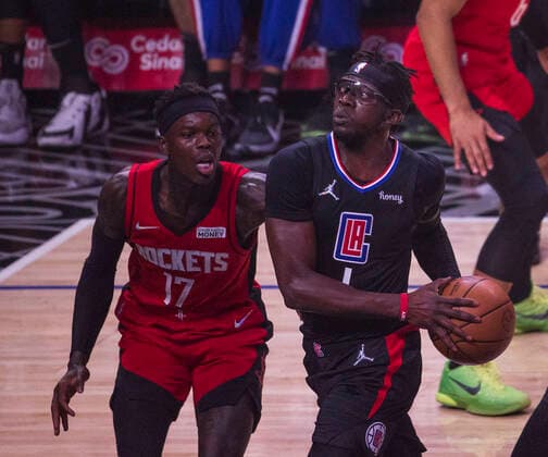 February 17, 2022, Los Angeles, California, USA: Reggie Jackson 1 of the Los Angeles Clippers passes the ball as Dennis Schroder 17 of the Houston Rockets attempts to block during their NBA, Basketball Herren, USA game on Thursday February 17, 2022 at Crypto.com Arena in Los Angeles, California. Clippers defeat Rockets, 142-111. ARIANA RUIZ PI Los Angeles USA - ZUMAp124 20220217_zaa_p124_080 Copyright: xArianaxRuizx