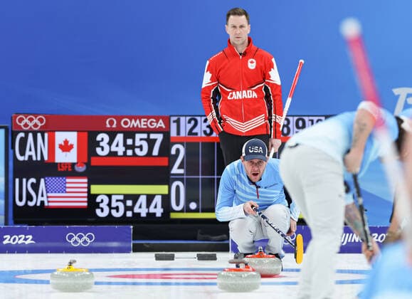 (220218) -- BEIJING, Feb. 18, 2022 -- Brad Gushue (rear) of Canada and John Shuster of the United States react during the curling man s bronze medal game of the Beijing 2022 Winter Olympics between Canada and the United States at the National Aquatics center in Beijing, China, Feb.18, 2022. ) (BEIJING 2022)CHINA-BEIJING-OLYMPIC Winter games, Winterspiele,Spiele, Summer games CURLING-MAN-BRONZE MEDAL-USA vs CAN(CN) WangxJingqiang 