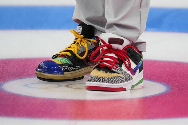 Team USA curling player Matt Hamilton wears multi coloured shoes during their Men s Curling Bronze Medal Game against Team Canada at the Beijing 2022 Winter Olympics on Friday, February 18, 2022.  OLY20220218210 PaulxHanna