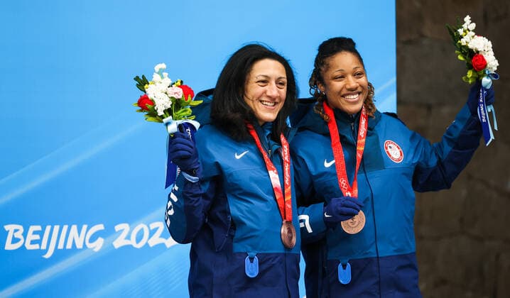 BEIJING, CHINA - FEBRUARY 19, 2022: Bronze medalists Elana Meyers Taylor (L) and Sylvia Hoffman of the USA at a flower ceremony for the 2-woman bobsleigh at the 2022 Winter Olympic Games, Olympische Spiele, Olympia, OS at the Yanqing National Sliding Centre. Anton Novoderezhkin TASS  TS12466F