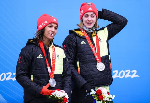BEIJING, CHINA - FEBRUARY 19, 2022: Silver medalists Mariama Jamanka (L) and Alexandra Burghardt of Germany at a flower ceremony for the 2-woman bobsleigh at the 2022 Winter Olympic Games, Olympische Spiele, Olympia, OS at the Yanqing National Sliding Centre. Anton Novoderezhkin TASS  TS124670