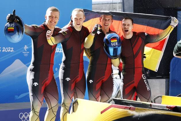 Beijing Olympics: Bobsleigh Germany s Francesco Friedrich, Thorsten Margis, Candy Bauer and Alexander Schueller celebrate after winning the four-man bobsleigh competition at the Beijing Winter Olympics on Feb. 20, 2022, at the National Sliding Centre in the Yanqing competition zone.  A14AA0001254042P
