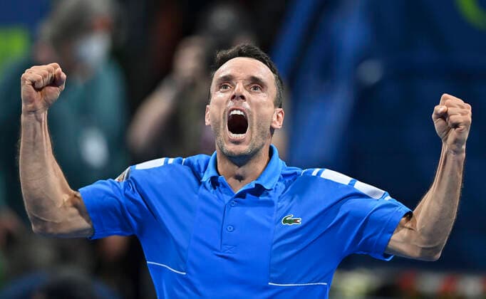 (220220) -- DOHA, Feb. 20, 2022 -- Roberto Bautista Agut of Spain celebrates after winning the ATP, Tennis Herren Qatar Open tennis tournament final at the Khalifa International Tennis Complex in Doha, Feb.19, 2022. (Photo by Xinhua) (SP)QATAR-DOHA-TENNIS-ATP QATAR OPEN Nikku 