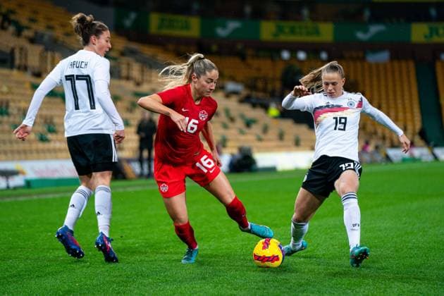 Norwich, England, February 20th Janine Beckie (16 Canada) gliding past 2 German defenders during the Arnold Clark Cup game between Canada and Germany at Carrow Road in Norwich, England Sam Mallia SPP Canada v Germany - Arnold Clark Cup - Carrow Road 
