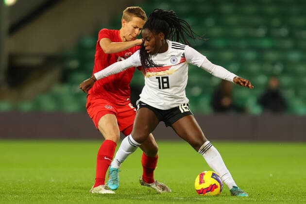 20th February 2022 ; Carrow Road, Norwich, Norforlk, England; Arnold Clark Womens International football Canada versus Germany: Nicole Anyomi of Germany under pressure from Quinn Of Canada  ActionPlus12366187 ShaunxBrooks