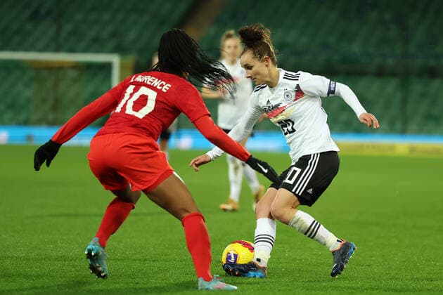 20th February 2022 ; Carrow Road, Norwich, Norforlk, England; Arnold Clark Womens International football Canada versus Germany: Lina Magull of Germany takes on Ashley Lawrence of Canada  ActionPlus12366210 ShaunxBrooks