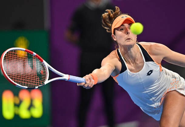 (220221) -- DOHA, Feb. 21, 2022 -- Alize Cornet of France returns the ball during the first round of WTA, Tennis Damen Qatar Open tennis tournament match against Liudmila Samsonova of Russia at the Khalifa International Tennis Complex in Doha, capital of Qatar, on Feb. 20, 2022. (Photo by Nikku Xinhua) (SP)QATAR-DOHA-TENNIS-WTA QATAR OPEN yangyuanyong 