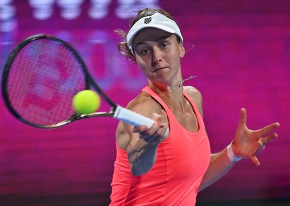 (220221) -- DOHA, Feb. 21, 2022 -- Liudmila Samsonova of Russia returns the ball during the first round of WTA, Tennis Damen Qatar Open tennis tournament match against Aliz Cornet of France at the Khalifa International Tennis Complex in Doha, capital of Qatar, on Feb. 20, 2022. (Photo by Nikku Xinhua) (SP)QATAR-DOHA-TENNIS-WTA QATAR OPEN yangyuanyong 