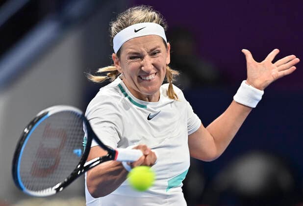 (220221) -- DOHA, Feb. 21, 2022 -- Victoria Azarenka of Belarus hits a return during the first round of WTA, Tennis Damen Qatar Open tennis tournament match against Yulia Putintseva of Kazakhstan at the Khalifa International Tennis Complex in Doha, capital of Qatar, on Feb. 20, 2022. (Photo by Nikku Xinhua) (SP)QATAR-DOHA-TENNIS-WTA QATAR OPEN yangyuanyong 