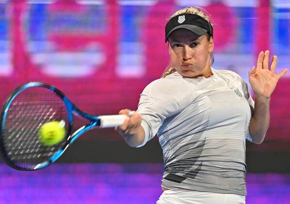 (220221) -- DOHA, Feb. 21, 2022 -- Yulia Putintseva of Kazakhstan hits a return during the first round of WTA, Tennis Damen Qatar Open tennis tournament match against Victoria Azarenka of Belarus at the Khalifa International Tennis Complex in Doha, capital of Qatar, on Feb. 20, 2022. (Photo by Nikku Xinhua) (SP)QATAR-DOHA-TENNIS-WTA QATAR OPEN yangyuanyong 
