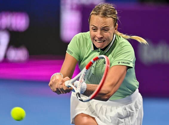 (220222) -- DOHA, Feb. 22, 2022 -- Anett Kontaveit of Estonia hits a return during the round of 32 of WTA, Tennis Damen Qatar Open tennis tournament match against Ana Konjuh of Croatia at the Khalifa International Tennis Complex in Doha, capital of Qatar, on Feb. 21, 2022. (Photo by Nikku Xinhua) (SP)QATAR-DOHA-TENNIS-WTA QATAR OPEN yangyuanyong 