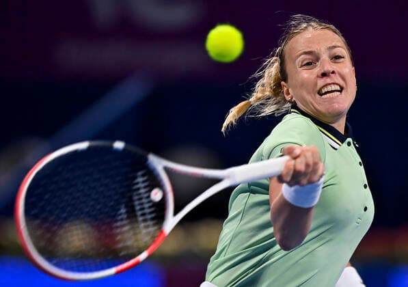 (220222) -- DOHA, Feb. 22, 2022 -- Anett Kontaveit of Estonia hits a return during the round of 32 of WTA, Tennis Damen Qatar Open tennis tournament match against Ana Konjuh of Croatia at the Khalifa International Tennis Complex in Doha, capital of Qatar, on Feb. 21, 2022. (Photo by Nikku Xinhua) (SP)QATAR-DOHA-TENNIS-WTA QATAR OPEN yangyuanyong 