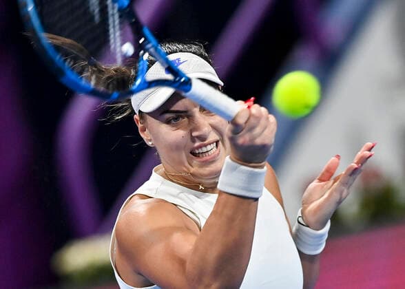 (220222) -- DOHA, Feb. 22, 2022 -- Ana Konjuh of Croatia hits a return during the round of 32 of WTA, Tennis Damen Qatar Open tennis tournament match against Anett Kontaveit of Estonia at the Khalifa International Tennis Complex in Doha, capital of Qatar, on Feb. 21, 2022. (Photo by Nikku Xinhua) (SP)QATAR-DOHA-TENNIS-WTA QATAR OPEN yangyuanyong 