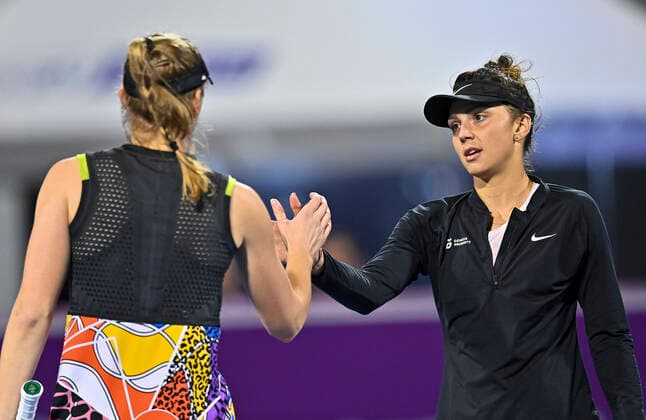 (220222) -- DOHA, Feb. 22, 2022 -- Jaqueline Cristian (R) of Romania shakes hands with Elena Rybakina of Kazakistan after the first round of WTA, Tennis Damen Qatar Open tennis tournament match at the Khalifa International Tennis Complex in Doha, capital of Qatar, on Feb. 21, 2022. (Photo by Xinhua) (SP)QATAR-DOHA-TENNIS-WTA QATAR OPEN Nikku 