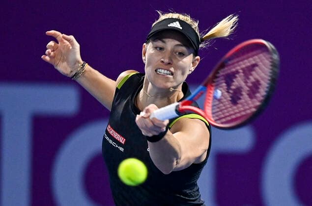 (220222) -- DOHA, Feb. 22, 2022 -- Angelique Kerber of Germany hits a return during the first round of WTA, Tennis Damen Qatar Open tennis tournament match against Jil Teichmann of Switzerland at the Khalifa International Tennis Complex in Doha, capital of Qatar, on Feb. 21, 2022. (Photo by Nikku Xinhua) (SP)QATAR-DOHA-TENNIS-WTA QATAR OPEN yangyuanyong 