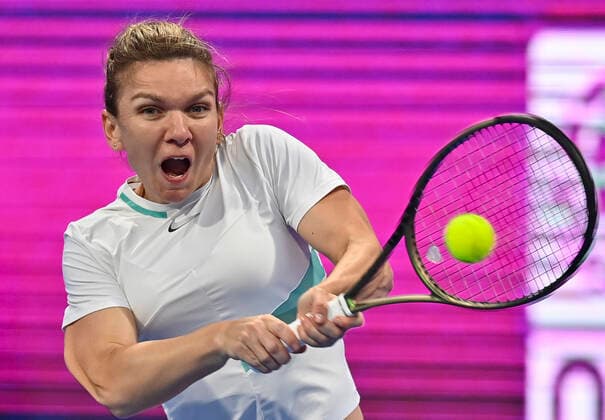 (220222) -- DOHA, Feb. 22, 2022 -- Simona Halep of Romania hits a return during the first round of WTA, Tennis Damen Qatar Open tennis tournament match against Caroline Garcia of France at the Khalifa International Tennis Complex in Doha, capital of Qatar, on Feb. 21, 2022. (Photo by Nikku Xinhua) (SP)QATAR-DOHA-TENNIS-WTA QATAR OPEN yangyuanyong 
