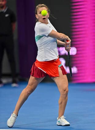 (220222) -- DOHA, Feb. 22, 2022 -- Simona Halep of Romania hits a return during the first round of WTA, Tennis Damen Qatar Open tennis tournament match against Caroline Garcia of France at the Khalifa International Tennis Complex in Doha, capital of Qatar, on Feb. 21, 2022. (Photo by Nikku Xinhua) (SP)QATAR-DOHA-TENNIS-WTA QATAR OPEN yangyuanyong 