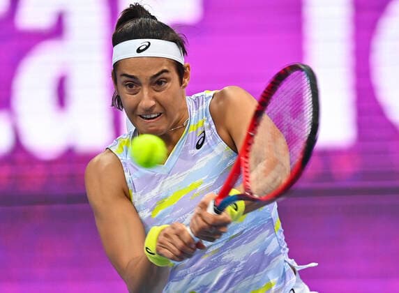 (220222) -- DOHA, Feb. 22, 2022 -- Caroline Garcia of France hits a return during the first round of WTA, Tennis Damen Qatar Open tennis tournament match against Simona Halep of Romania at the Khalifa International Tennis Complex in Doha, capital of Qatar, on Feb. 21, 2022. (Photo by Nikku Xinhua) (SP)QATAR-DOHA-TENNIS-WTA QATAR OPEN yangyuanyong 