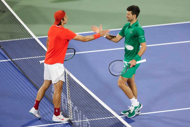 Lorenzo Musetti congratulates the winner Novak Djokovic SRB Tennis Dubai Duty Free Tennis Championships ATP Dubai Duty Free Tennis Stadium Dubai United Arab Emirates 21 February 2022 Copyright: xJuergenxHasenkopfx